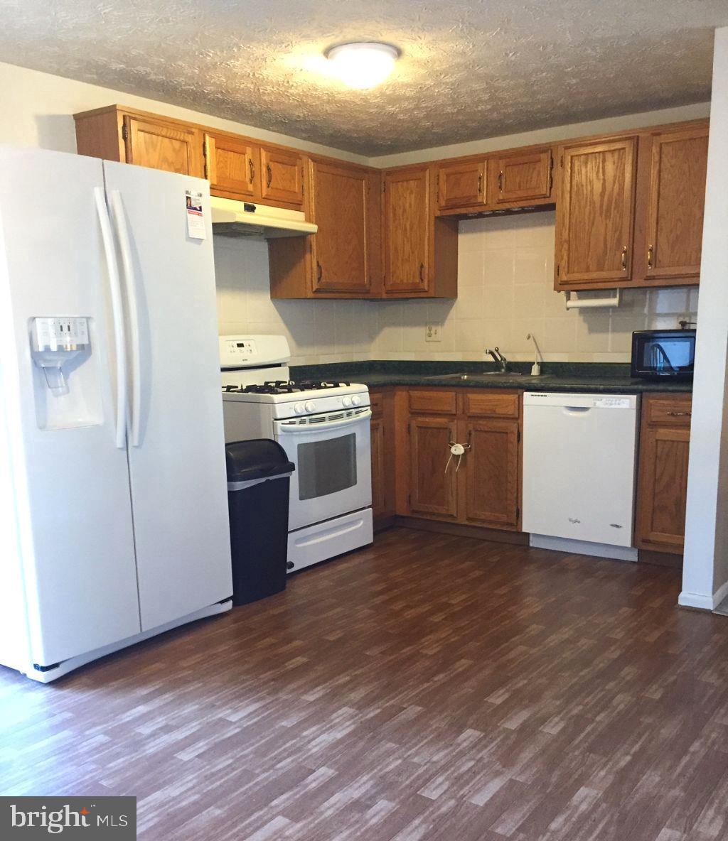 216 Compass Road Baltimore, MD 21221 - Photo 4 of 20 Spacious Kitchen with Vinyl flooring