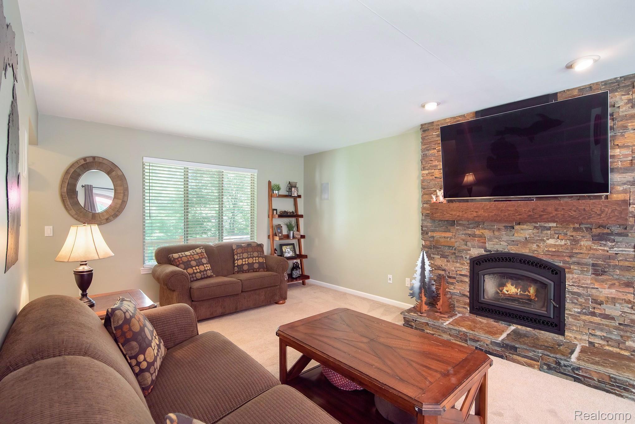 360 East Davisburg Road Holly, MI 48442 - Photo 7 of 30 Updated living room with stone fireplace