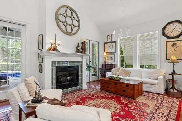 a living room with furniture and a fireplace
