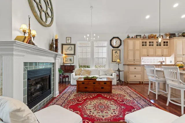 a view of a dining room with furniture wooden floor and a chandelier