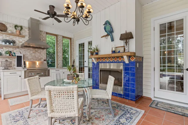 a dining room with furniture a chandelier and a rug