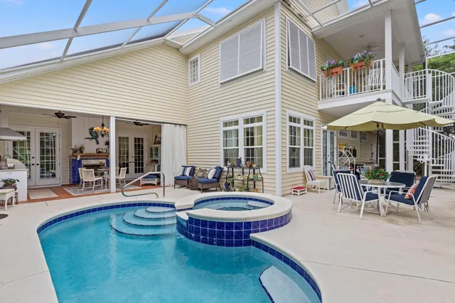 a kitchen with stainless steel appliances granite countertop a refrigerator and a stove