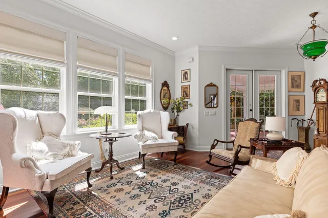 a bathroom with a toilet a sink and a mirror