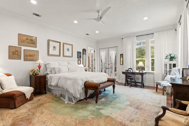 a bedroom with furniture and a chandelier