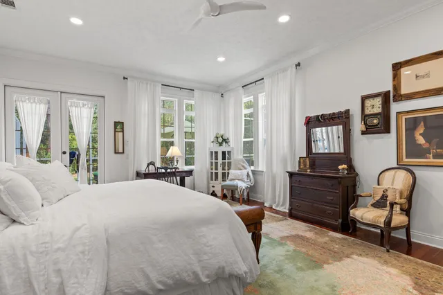 a bathroom with a sink vanity mirror and toilet