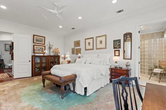 a bathroom with a granite countertop sink a toilet and shower