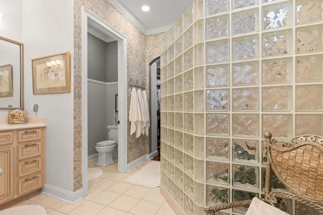 a balcony with furniture and large windows