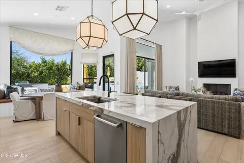 a kitchen with a sink and a stove