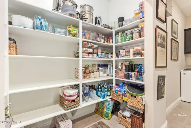 a bedroom with a bed and a mirror