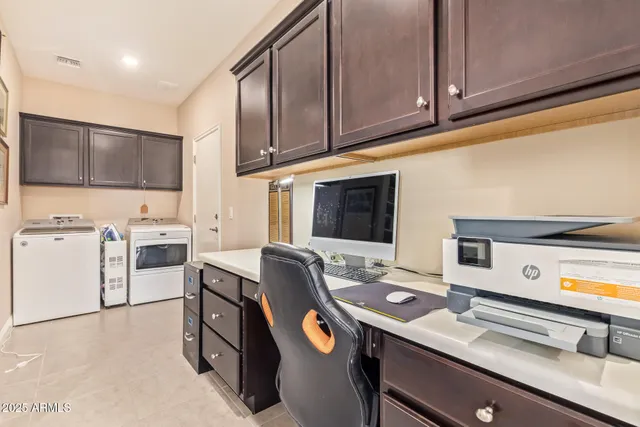 a view of a patio with table and chairs potted plants and palm trees