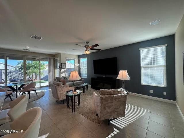 a kitchen with stainless steel appliances granite countertop a refrigerator sink and stove