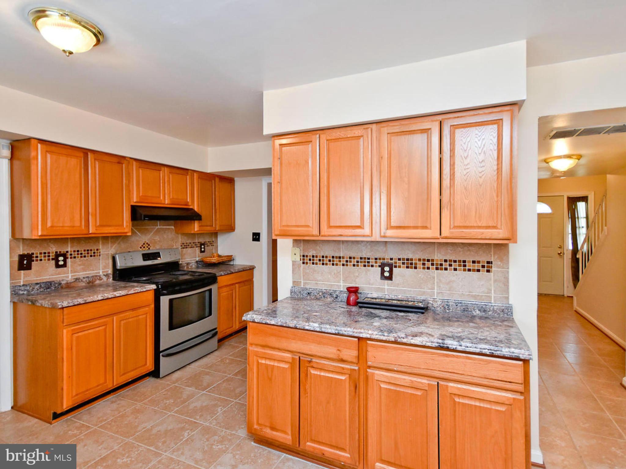 9114 Overlook Trail Fort Washington, MD 20744 - Photo 12 of 27 a kitchen with granite countertop a sink stainless steel appliances and cabinets
