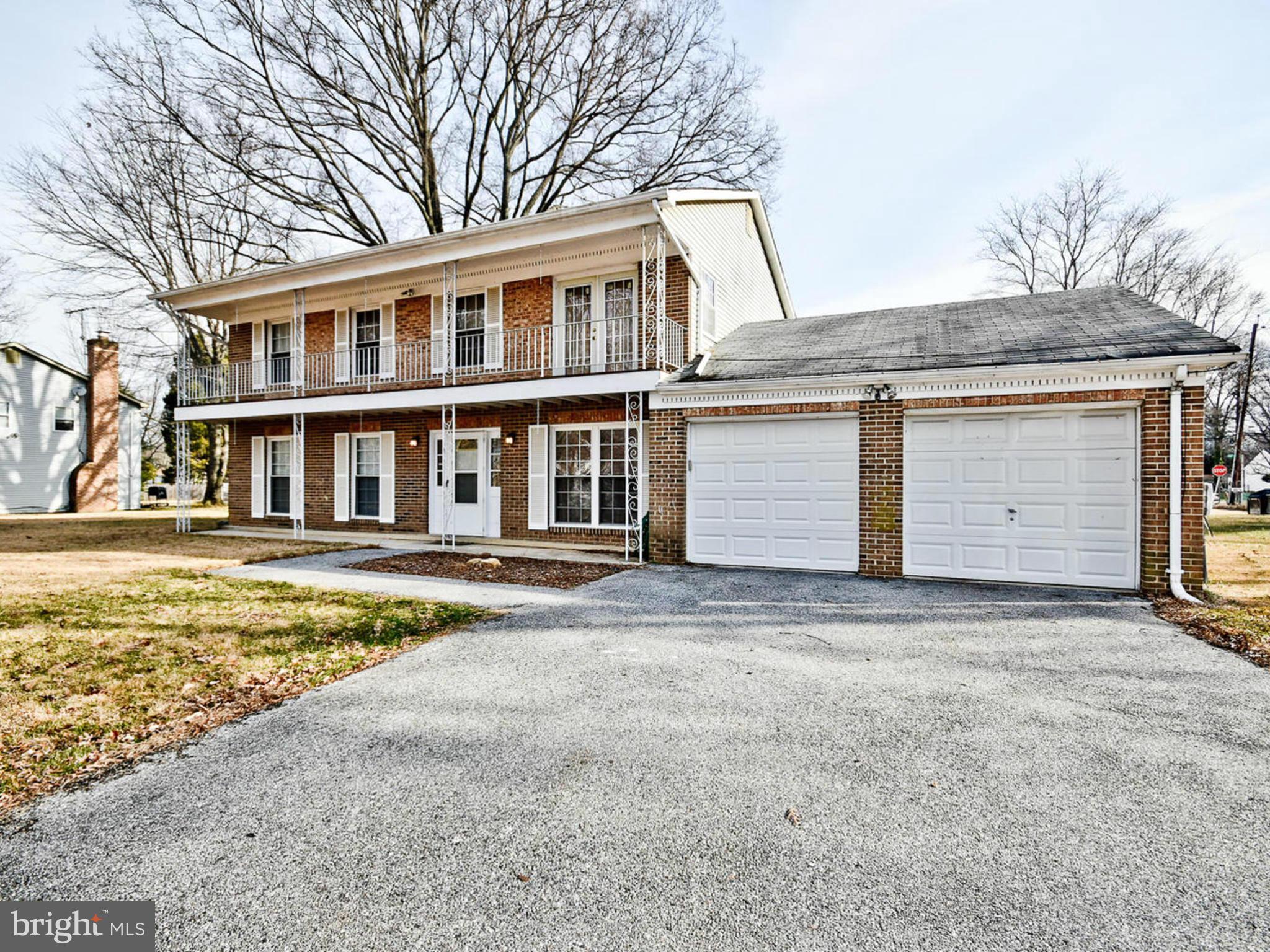 9114 Overlook Trail Fort Washington, MD 20744 - Photo 27 of 27 a front view of a house with a yard and garage