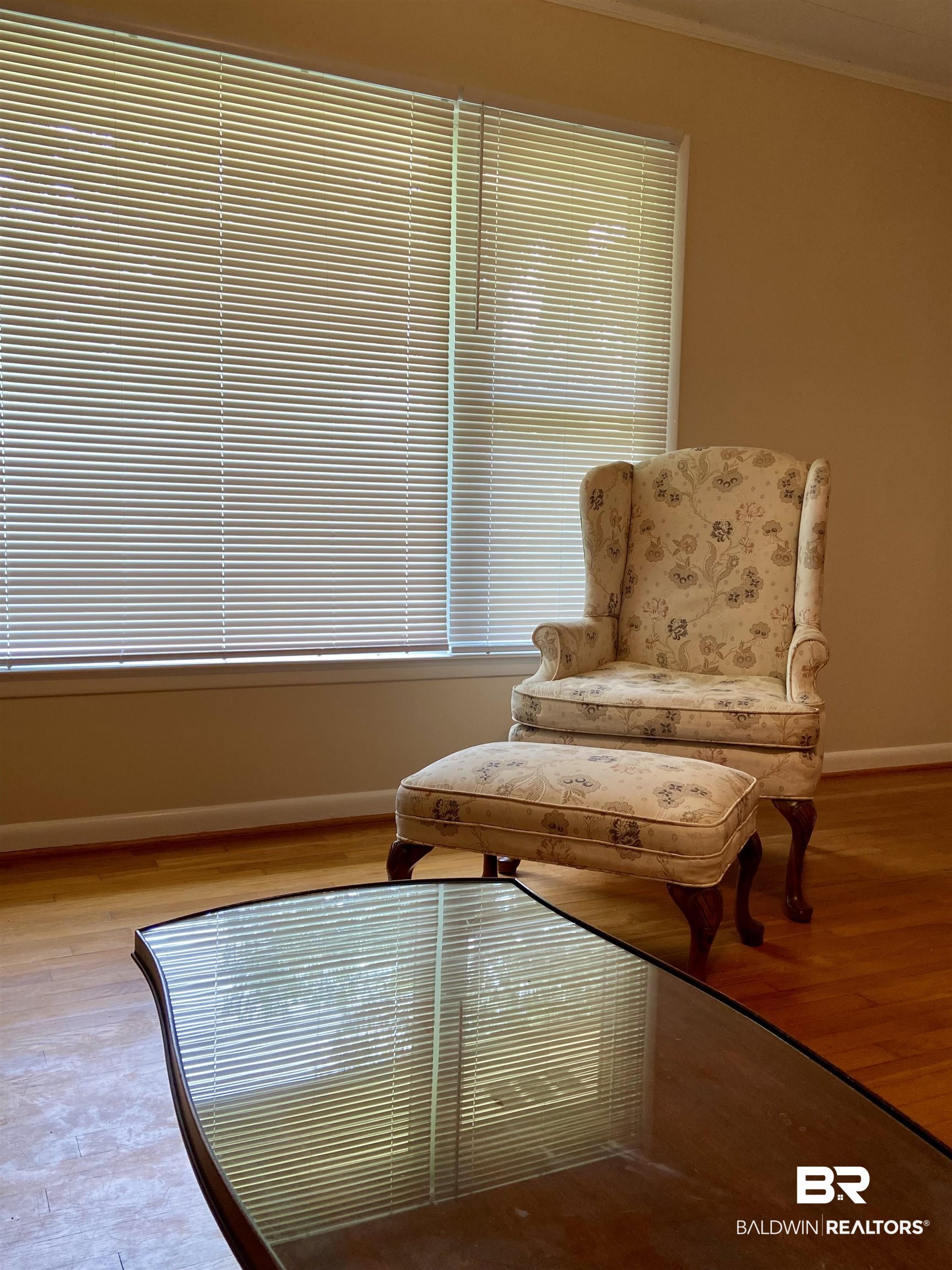 102 Ashley Street Evergreen, AL 36401 - Photo 7 of 26 Living area with crown molding and wood-type flooring