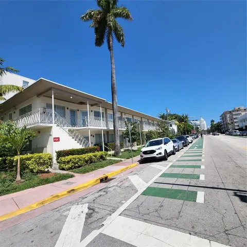 a front view of a building with garden