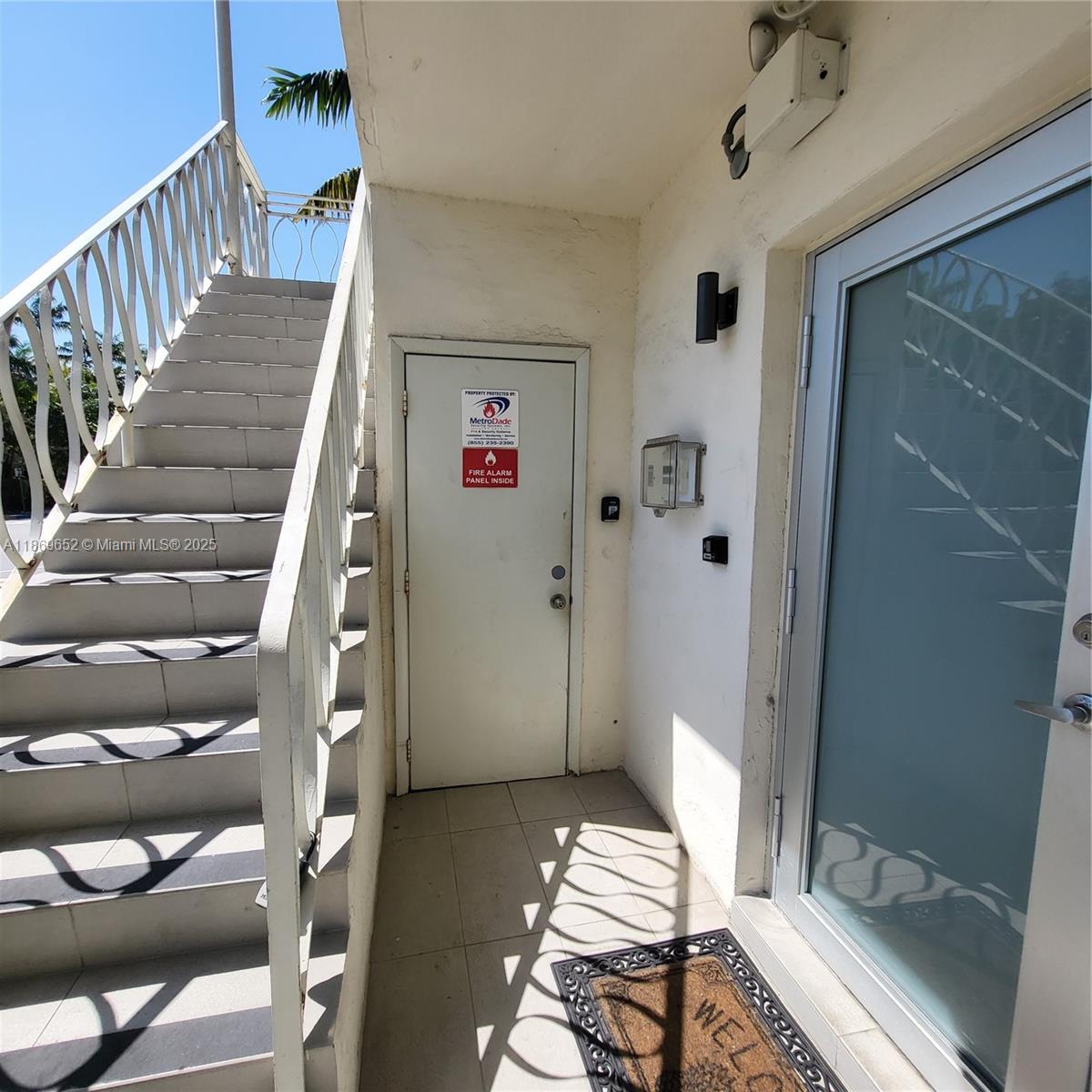 1601 Meridian Avenue, Unit 209 Miami Beach, FL 33139 - Photo 18 of 20 a view of a hallway with wooden floor and furniture
