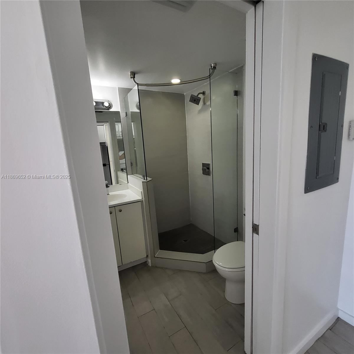1601 Meridian Avenue, Unit 209 Miami Beach, FL 33139 - Photo 5 of 20 a bathroom with a sink a toilet and shower