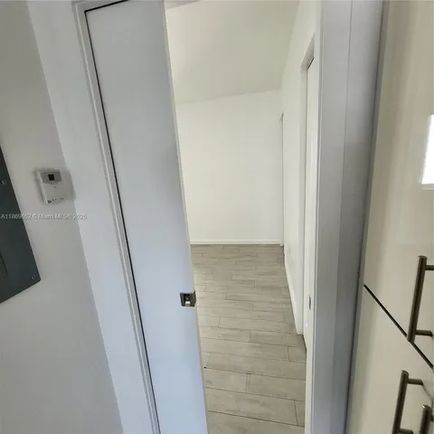 a view of hallway with shower