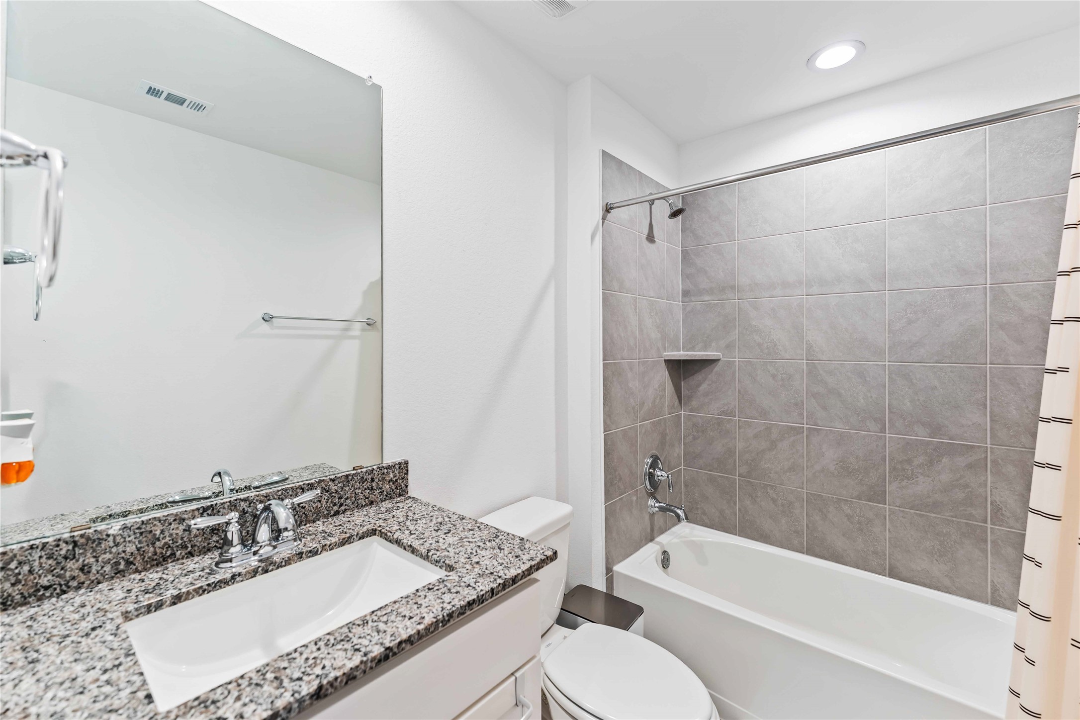 10610 Kings River Drive Rosharon, TX 77583 - Photo 12 of 33 a bathroom with a granite countertop sink toilet mirror and shower