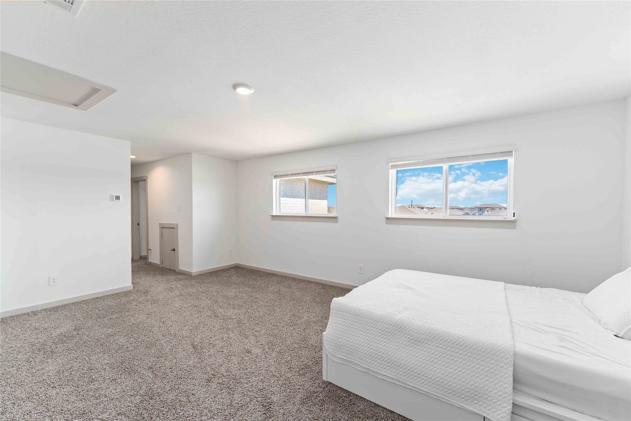 10610 Kings River Drive Rosharon, TX 77583 - Photo 14 of 33 a bedroom with a white bed and a window