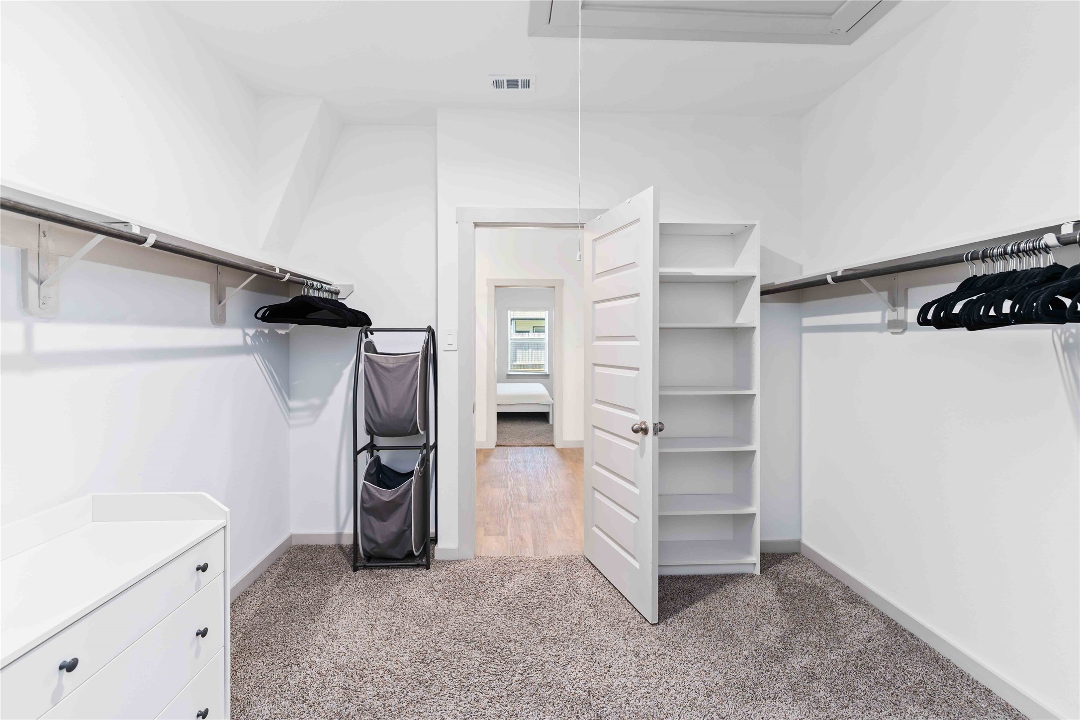 10610 Kings River Drive Rosharon, TX 77583 - Photo 16 of 33 a view of walk in closet with clothes and shoes