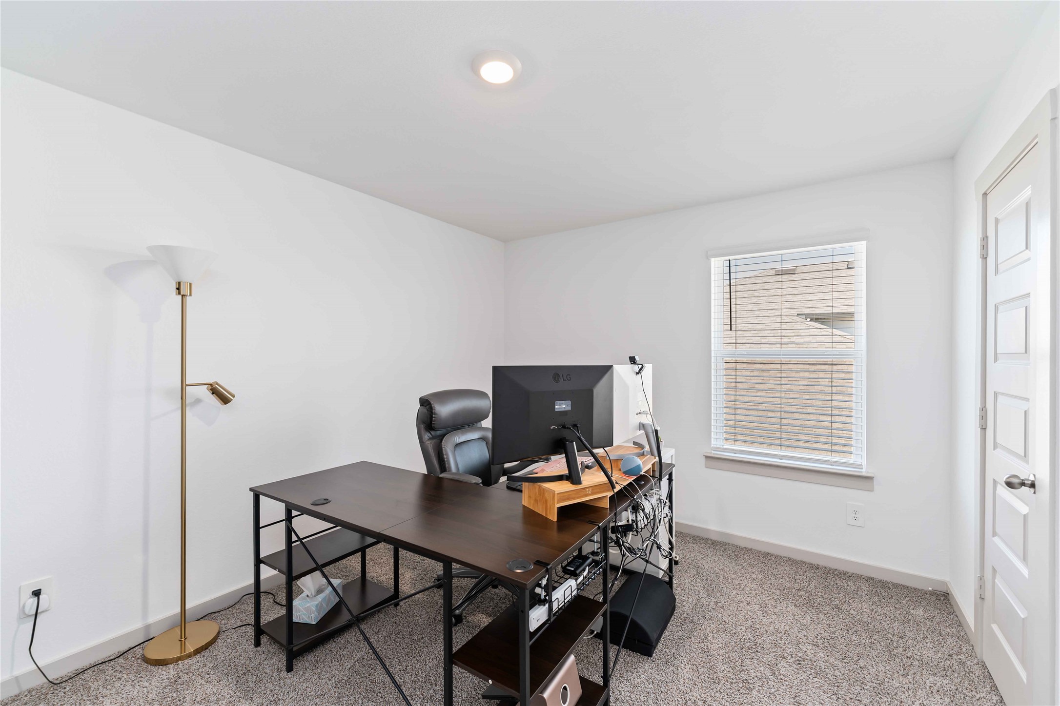 10610 Kings River Drive Rosharon, TX 77583 - Photo 10 of 33 a view of a workspace with furniture and a window