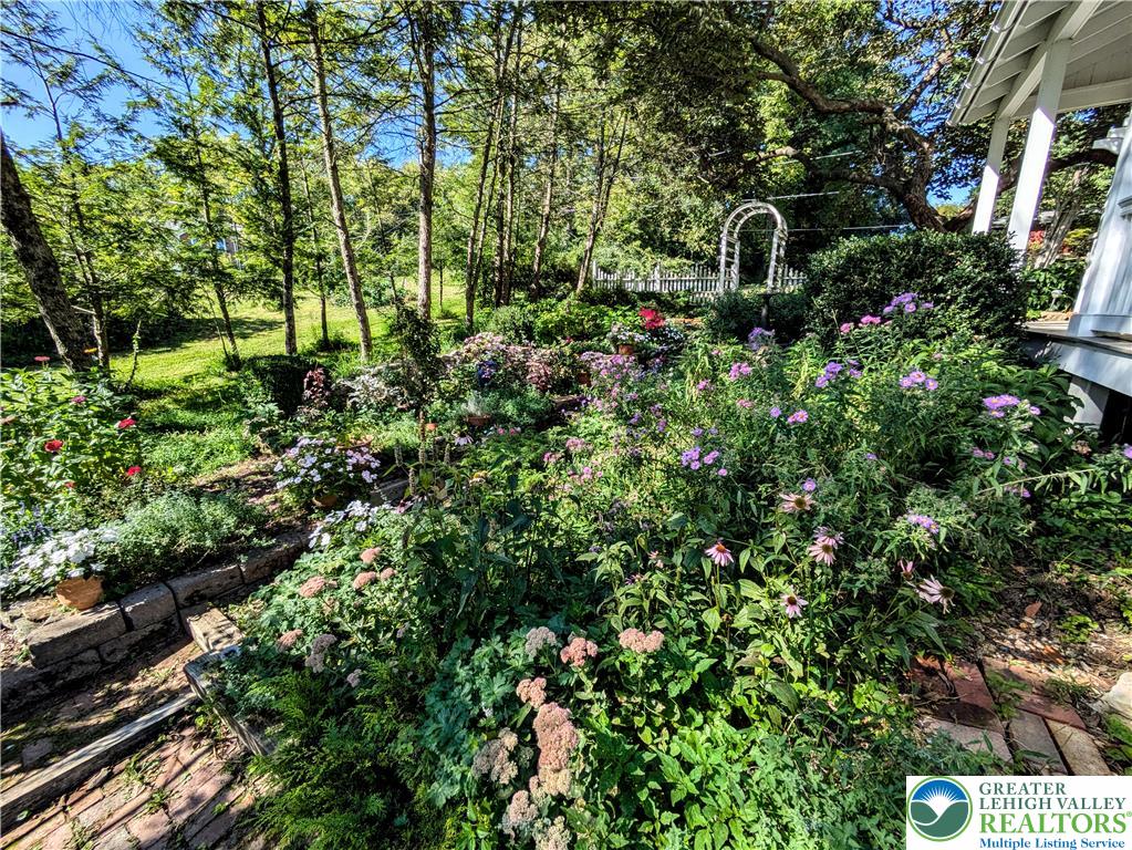 1731 Howell Road Easton, PA 18040 - Photo 47 of 60 Lush gardens and mature trees create a serene natural landscape surrounding the property.