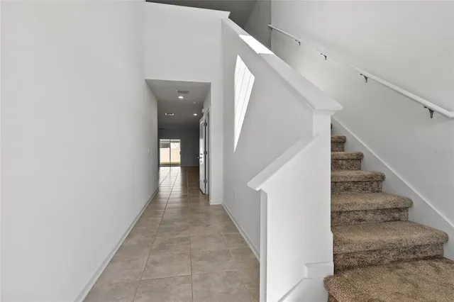 a view of a hallway with staircase
