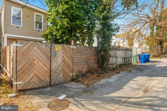 a view of a backyard with tree