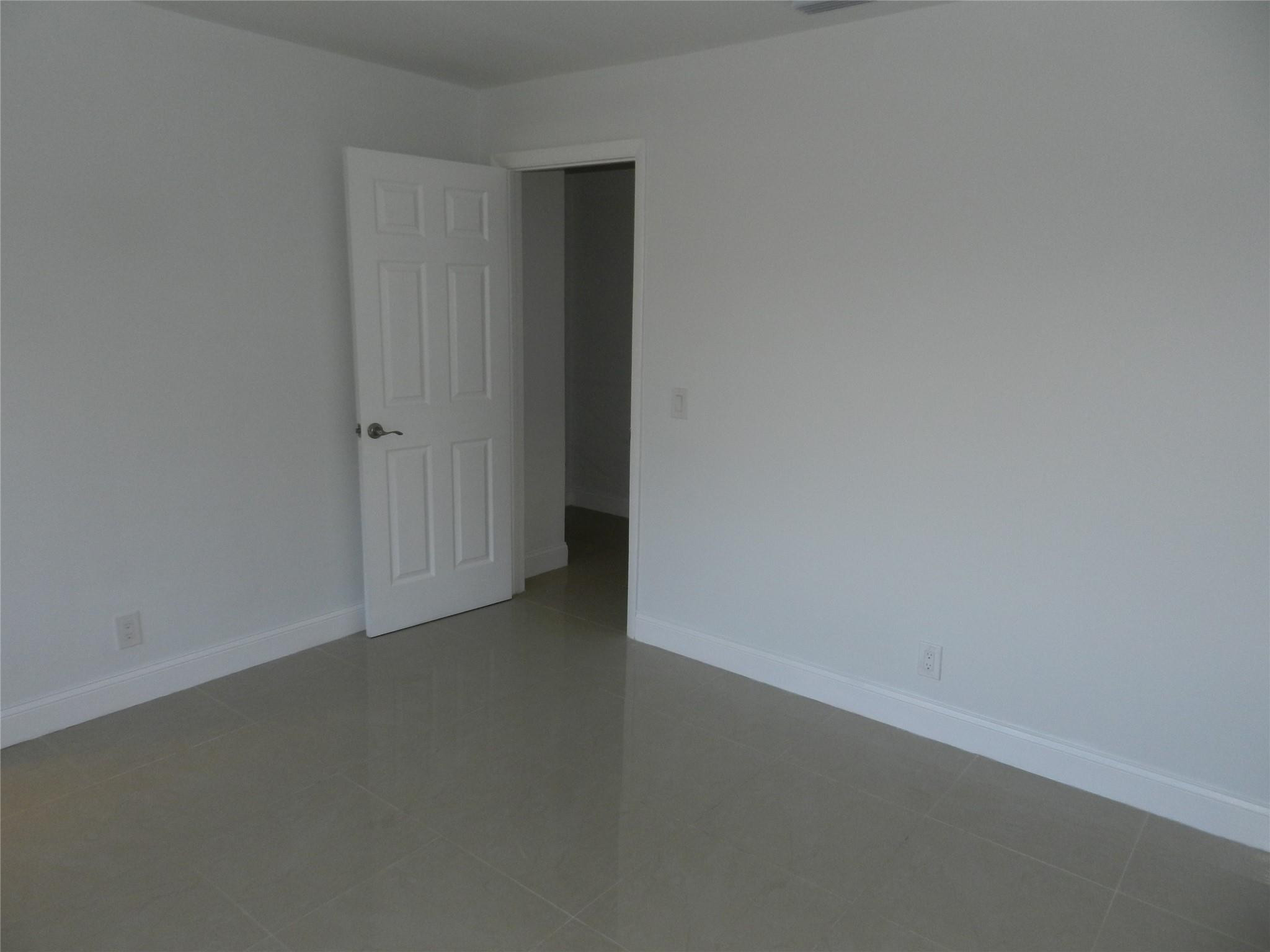 73 Deer Creek Road, Unit 103 Deerfield Beach, FL 33442 - Photo 26 of 28 Second Bedroom Facing Door