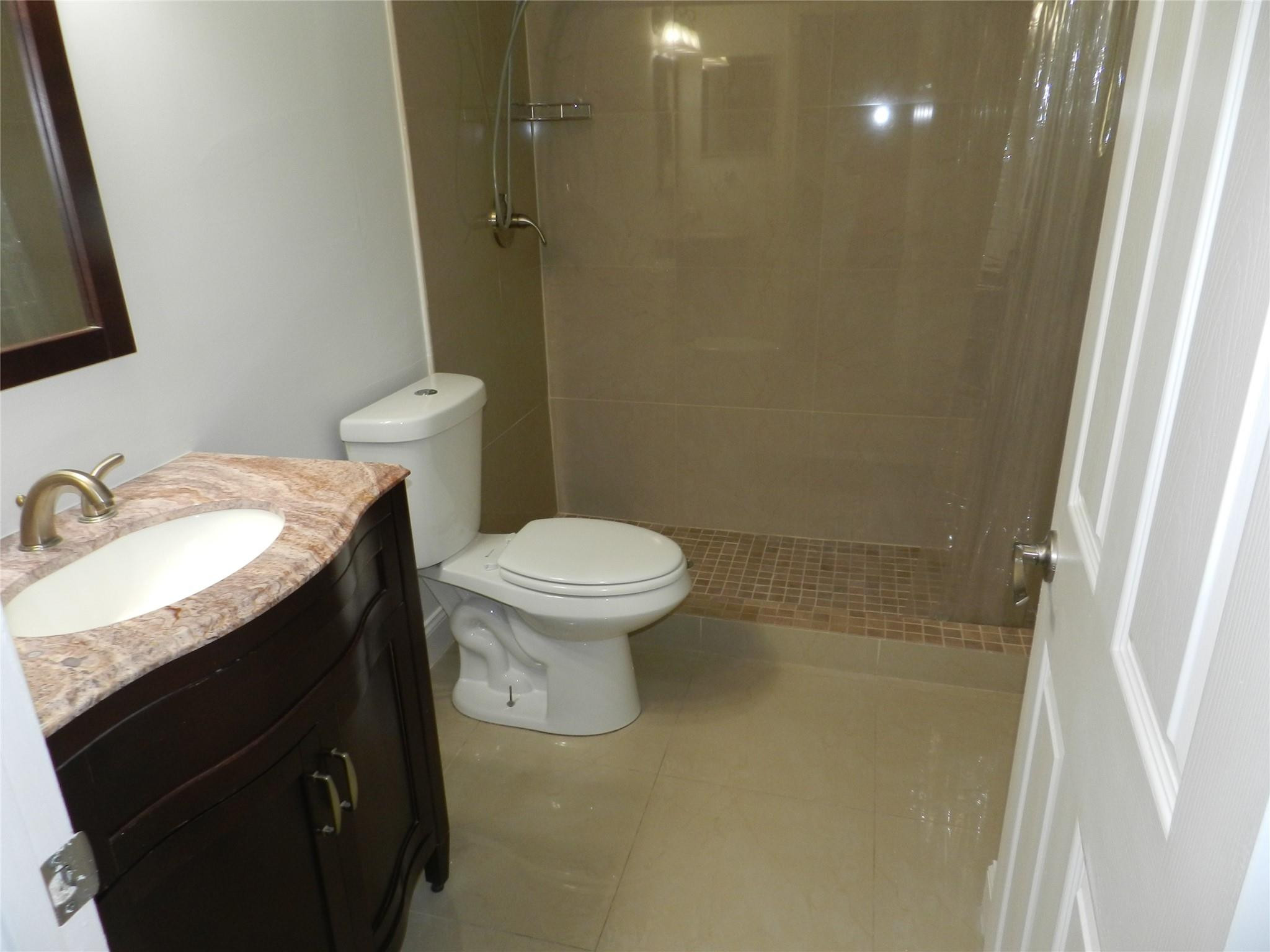 73 Deer Creek Road, Unit 103 Deerfield Beach, FL 33442 - Photo 5 of 28 Downstairs Bathroom