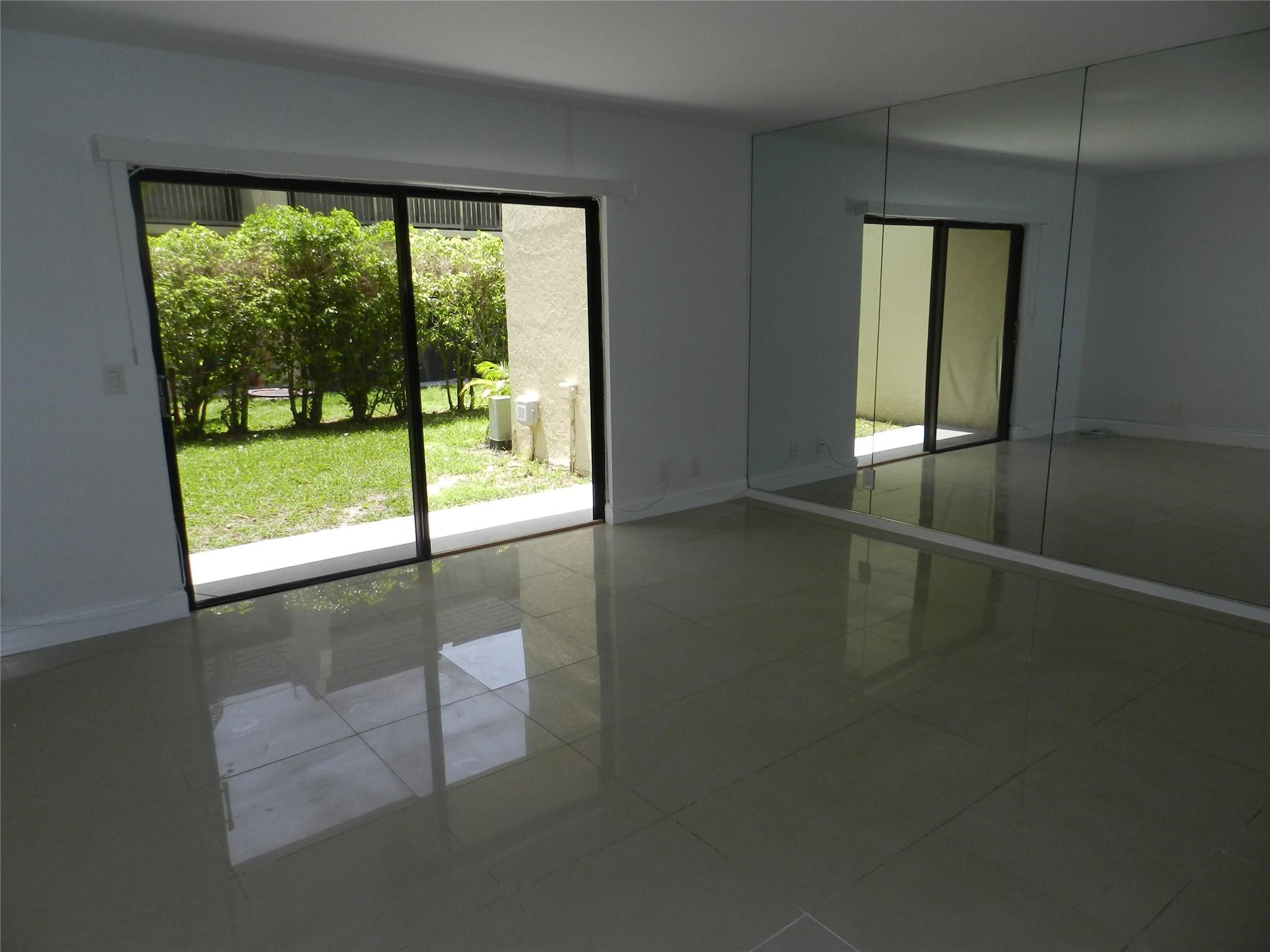 73 Deer Creek Road, Unit 103 Deerfield Beach, FL 33442 - Photo 7 of 28 Living Room Looking Out