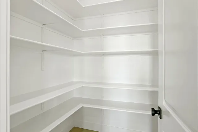 a kitchen with stainless steel appliances kitchen island a sink stove and refrigerator