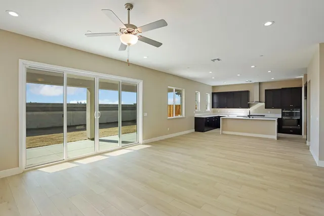 a view of a kitchen with a sink and microwave