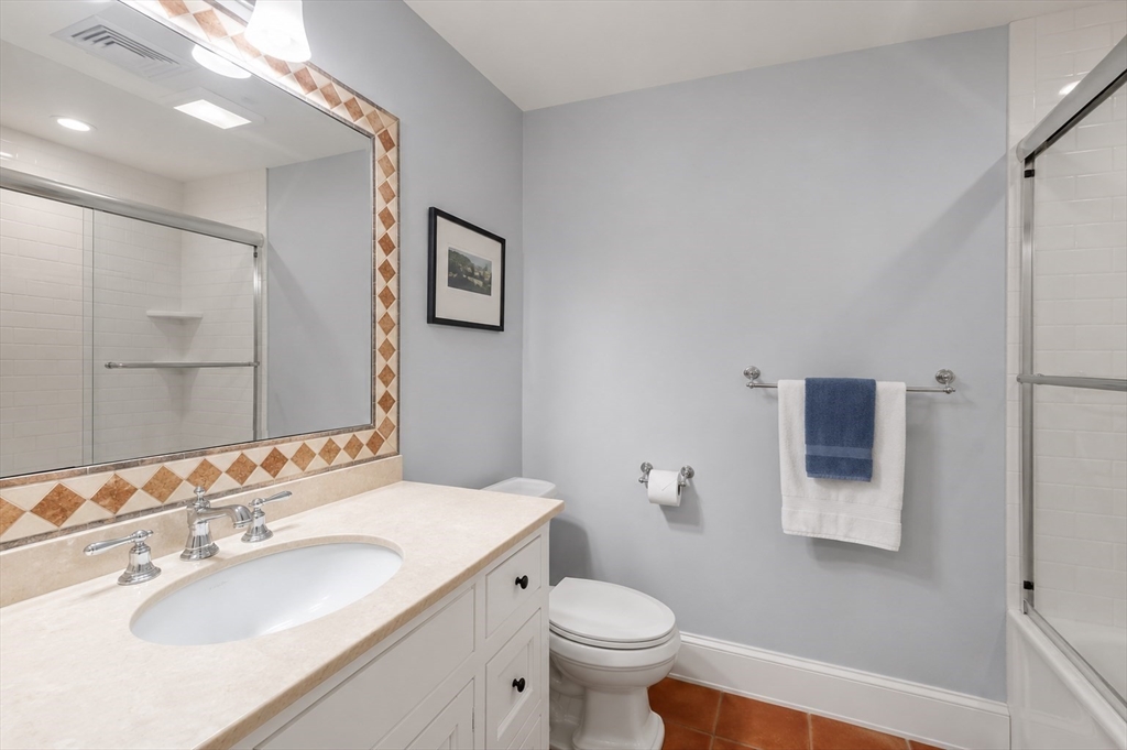 29 Maple Lane, Unit 29 Medfield, MA 02052 - Photo 25 of 42 a bathroom with a sink toilet and mirror