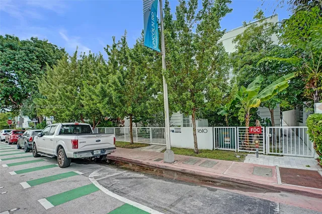 a view of a yard with car parked