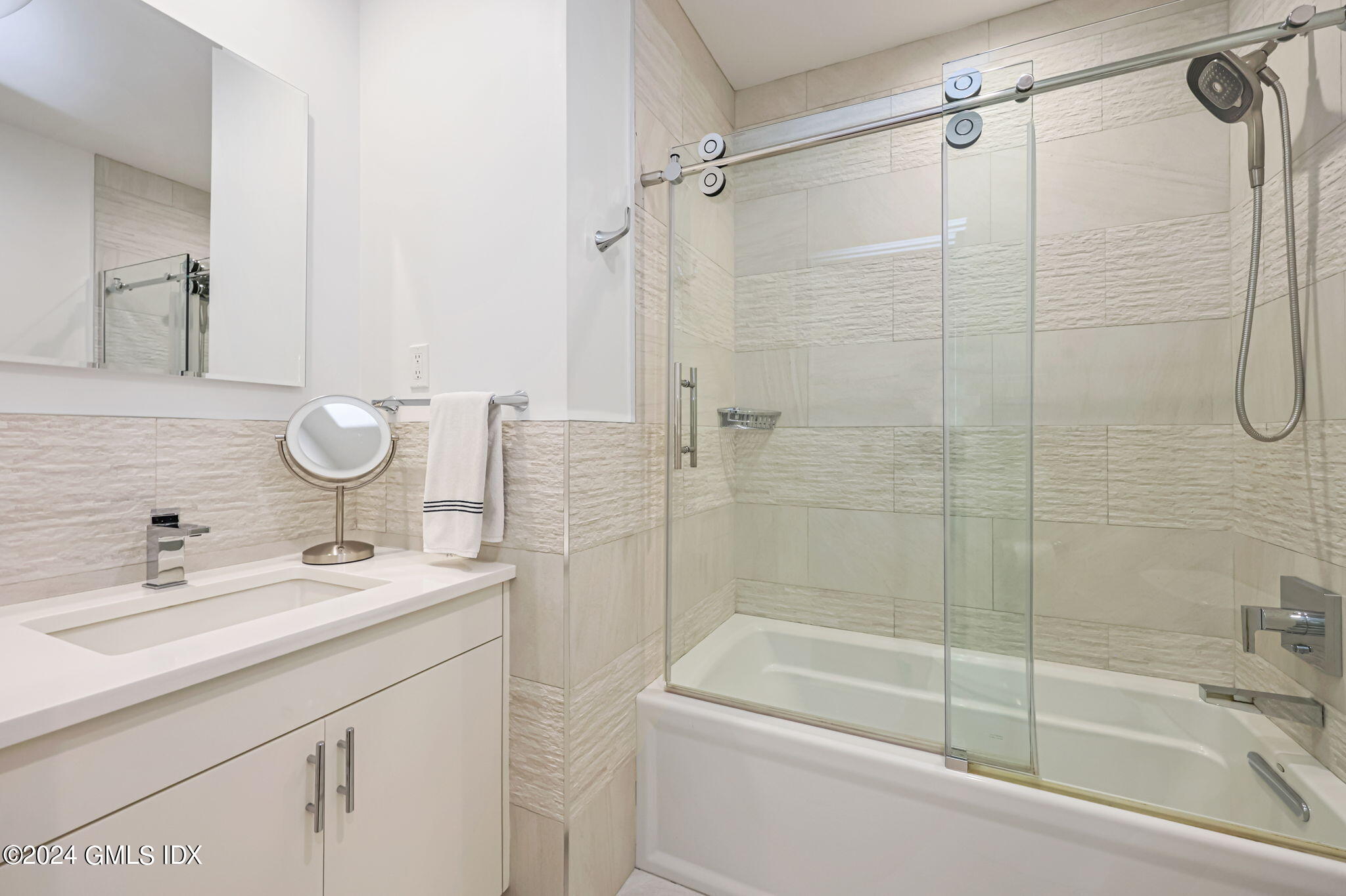 68 Willowmere Circle Riverside, CT 06878 - Photo 14 of 29 a bathroom with a shower sink vanity mirror and toilet
