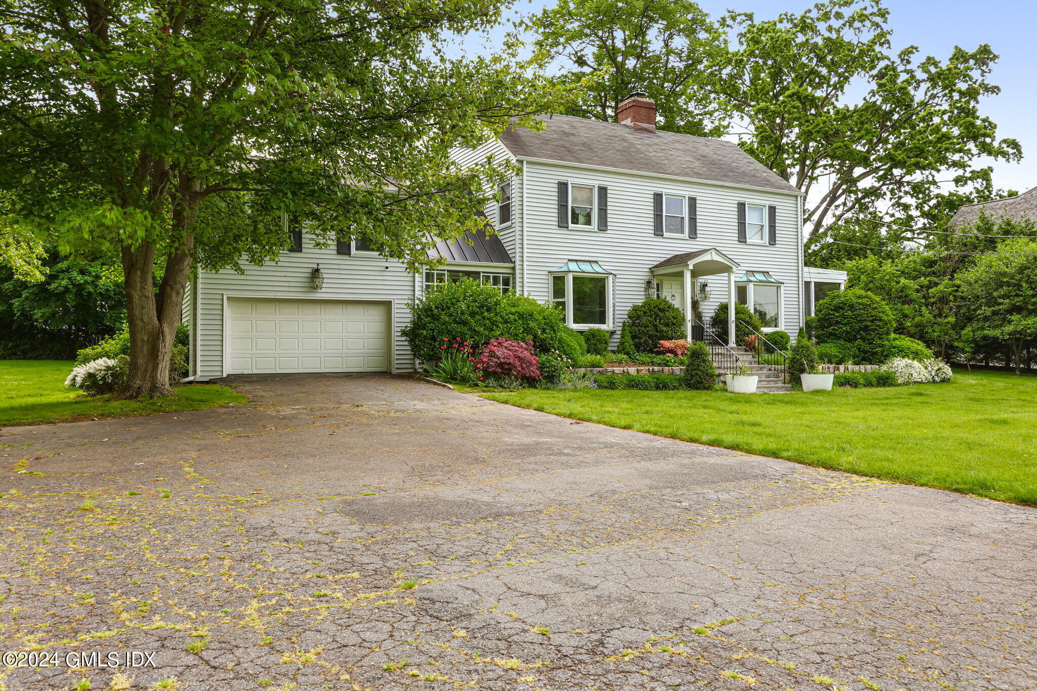 68 Willowmere Circle Riverside, CT 06878 - Photo 2 of 29 a front view of house with yard and green space