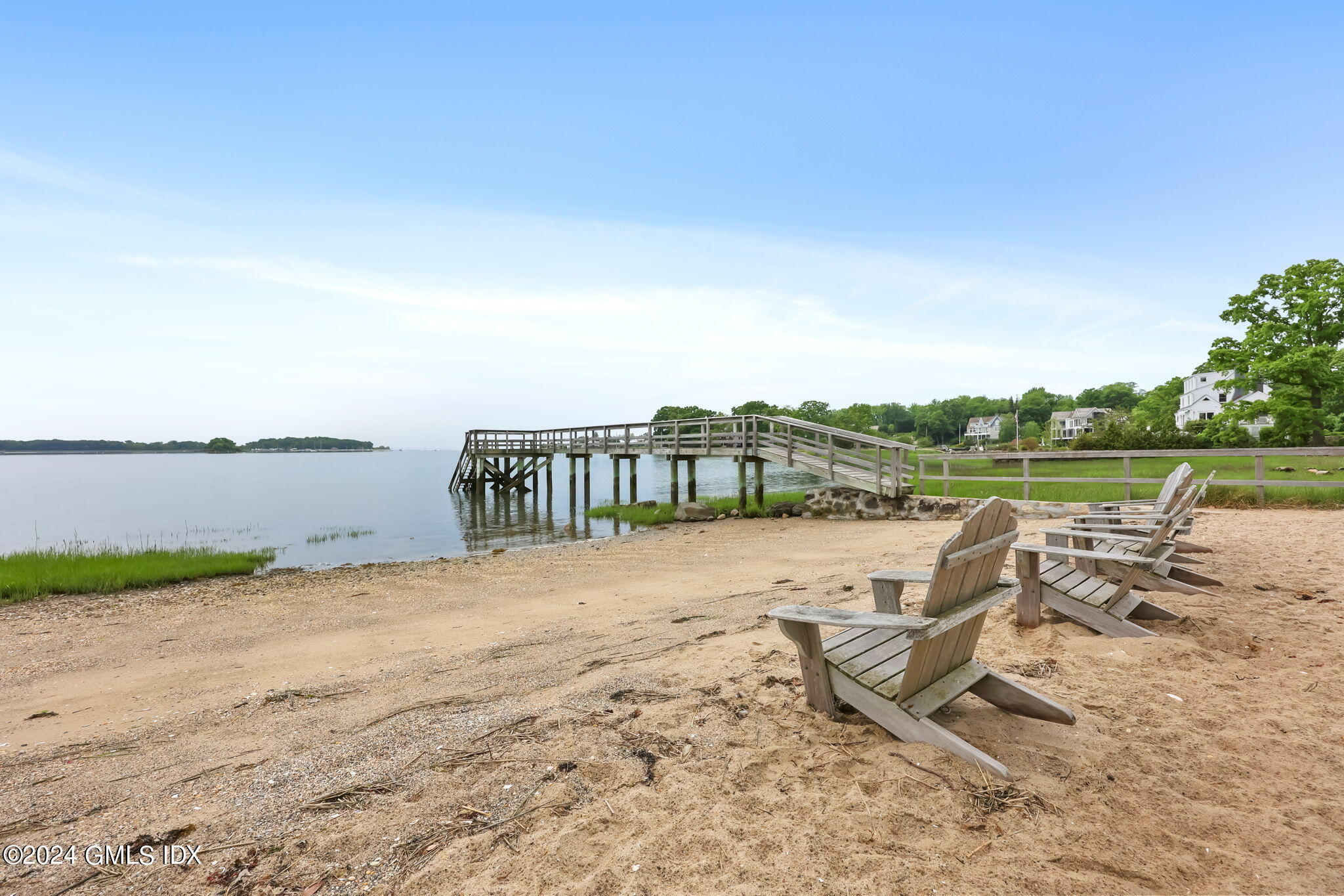 68 Willowmere Circle Riverside, CT 06878 - Photo 23 of 29 a view of swimming pool with lawn chairs and wooden fence