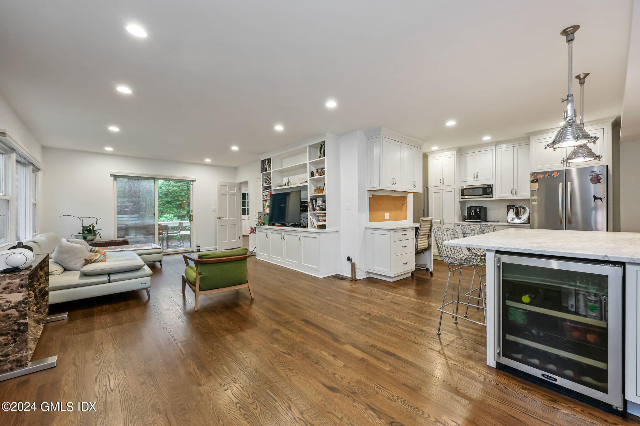 68 Willowmere Circle Riverside, CT 06878 - Photo 9 of 29 a living room with furniture wooden floor and kitchen view