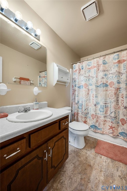 5280 West Quaker Road Disputanta, VA 23875 - Photo 32 of 33 a bathroom with a sink a toilet and shower