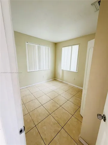 a view of empty room with windows