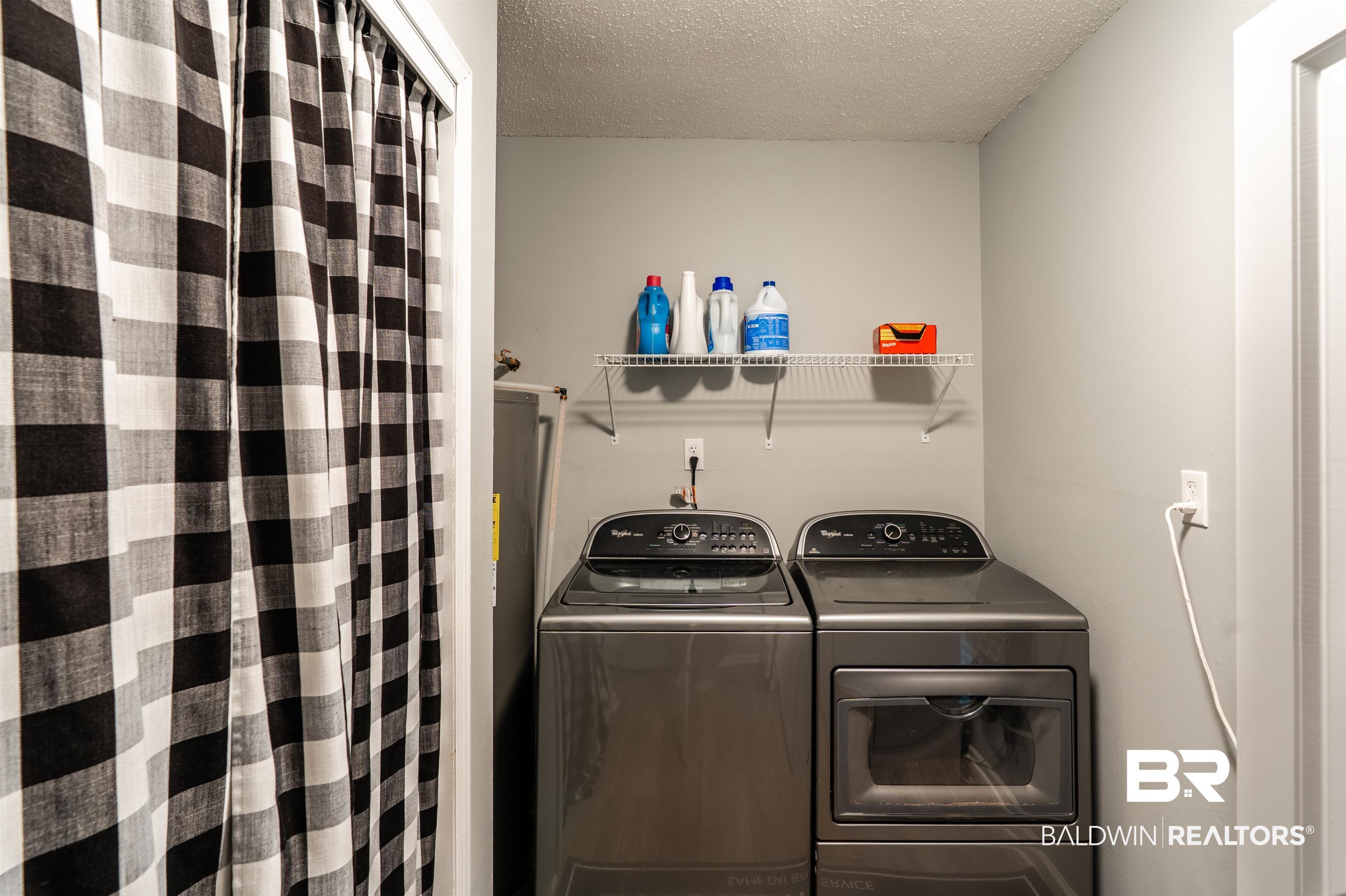 7669 Kali Oka Road Saraland, AL 36571 - Photo 20 of 29 Laundry area with independent washer and dryer and a textured ceiling