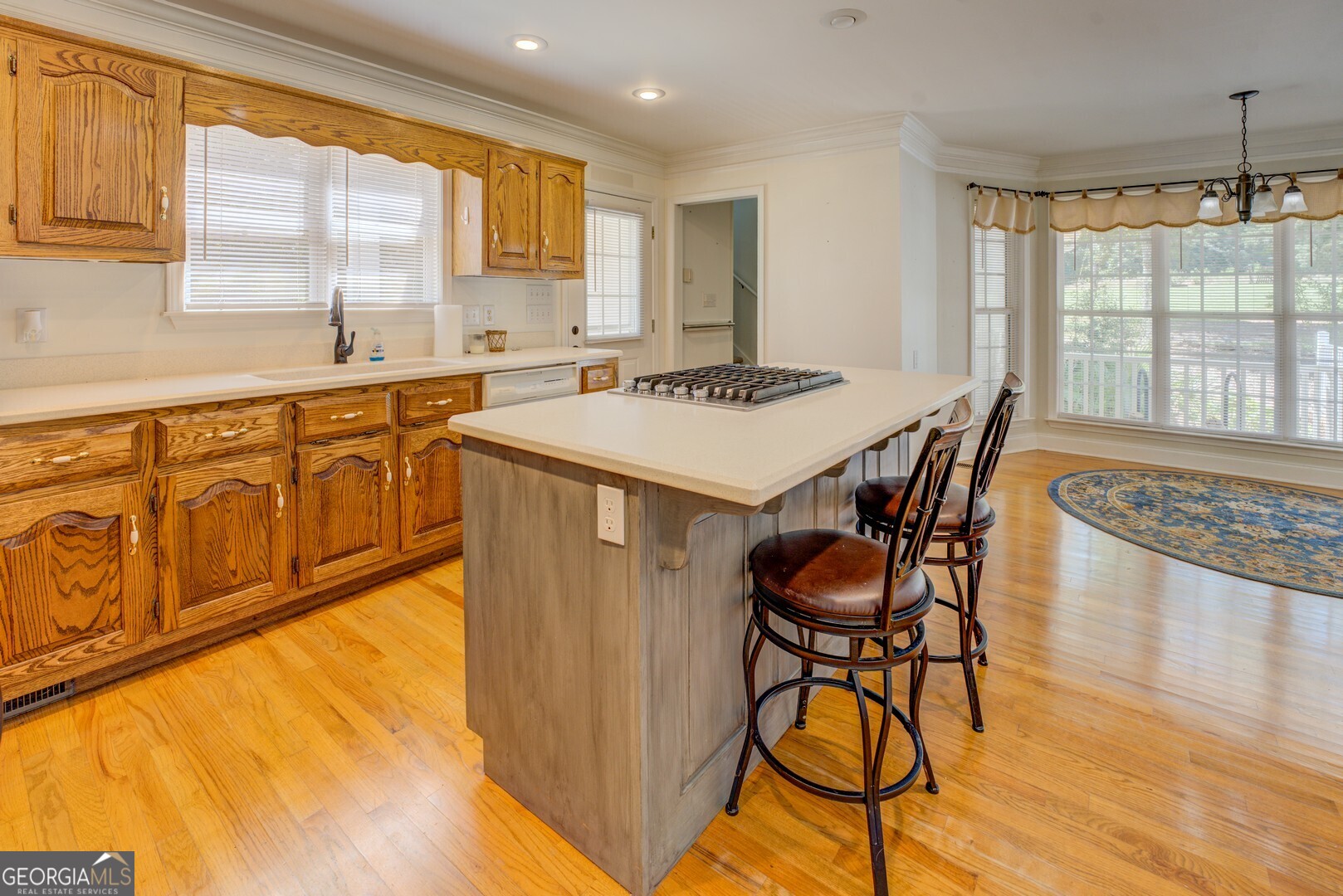 925 Highway 36 East Jackson, GA 30233 - Photo 18 of 90 a kitchen with stainless steel appliances granite countertop a table chairs and a large window