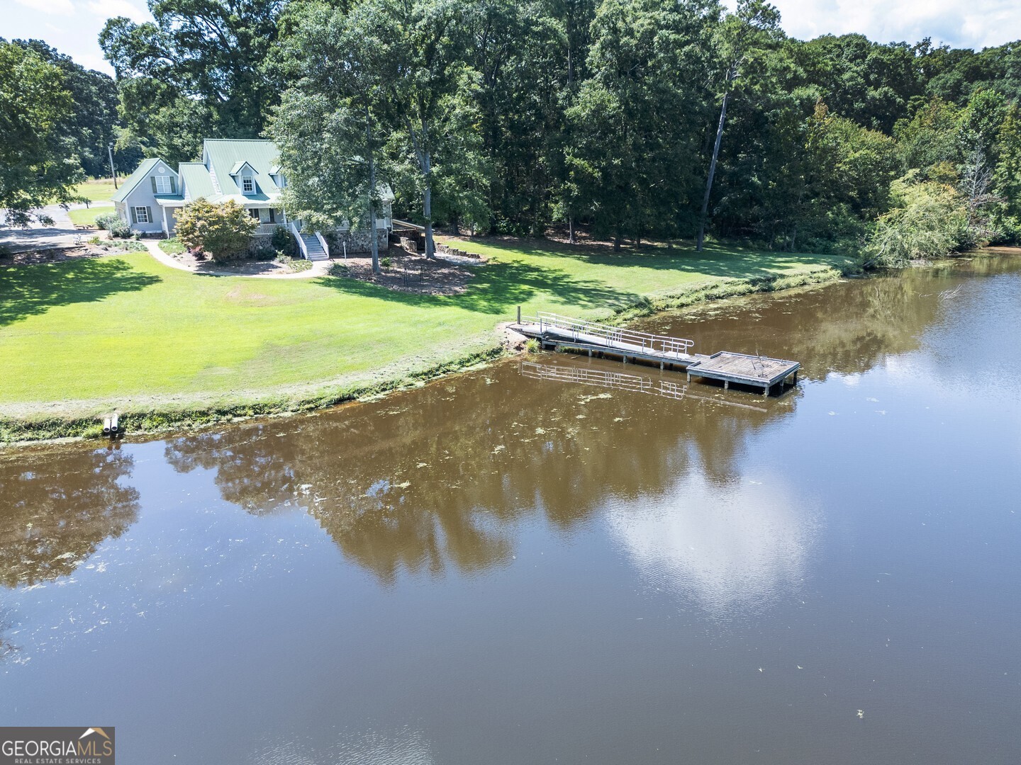 925 Highway 36 East Jackson, GA 30233 - Photo 2 of 90 a view of a lake with houses in the back