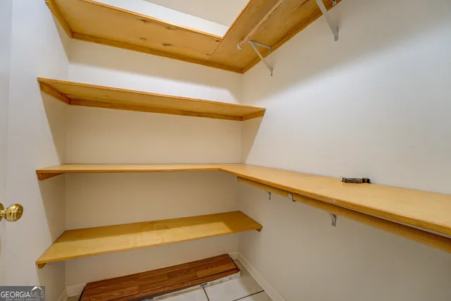 a bathroom with a glass shower door and a glass door