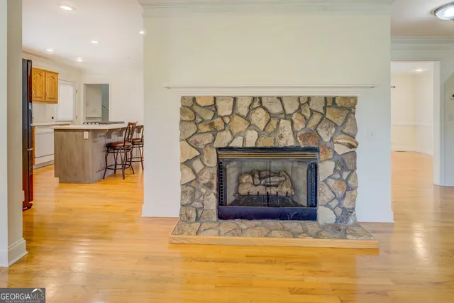 an empty room with a ceiling fan and a fan