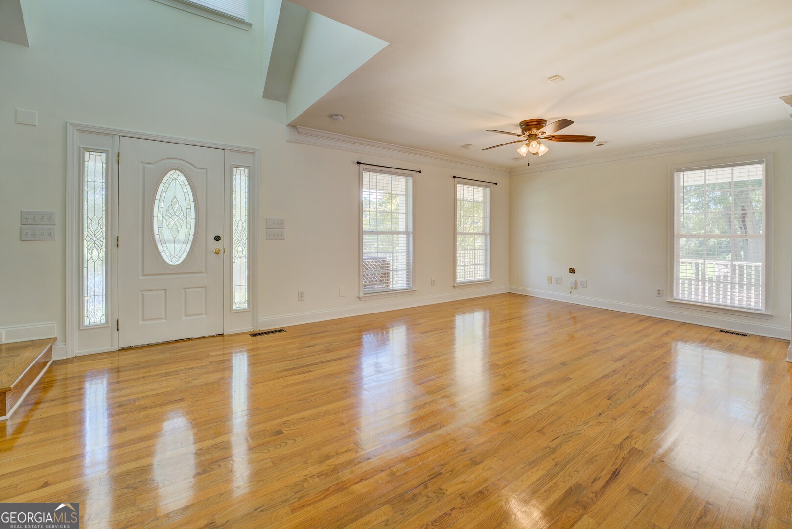 925 Highway 36 East Jackson, GA 30233 - Photo 32 of 90 a view of room with window and wooden floor