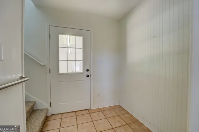 a kitchen with stainless steel appliances a stove a sink and a cabinets