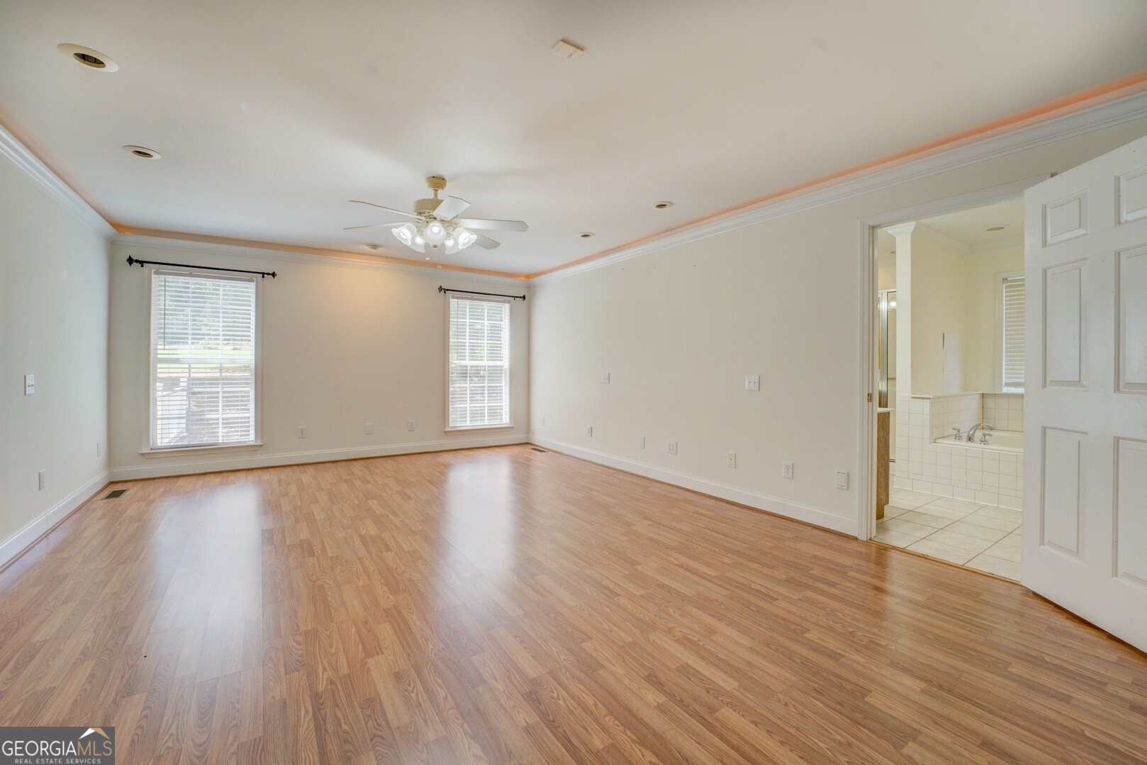 925 Highway 36 East Jackson, GA 30233 - Photo 37 of 90 a view of an empty room with wooden floor and a window